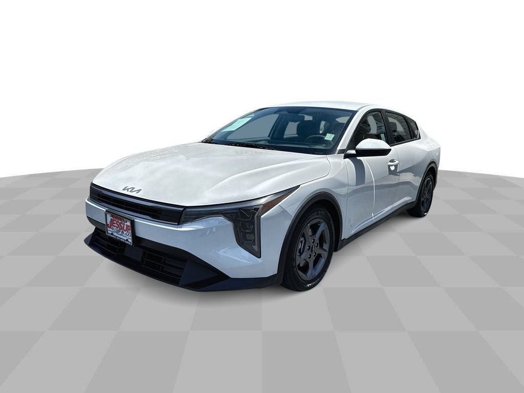 2025 Kia K4 LXS in White — front three-quarter view