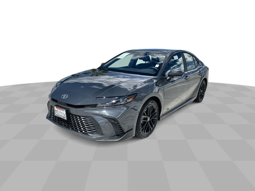 2025 Toyota Camry LE in Underground Grey — front three-quarter view