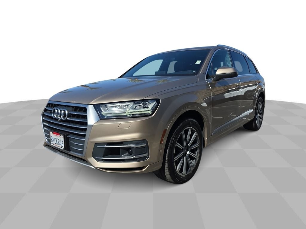 2019 Audi Q7 55 Premium in Beige — front three-quarter view
